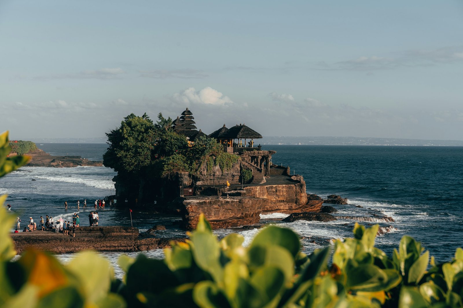 tana lot temple with waves